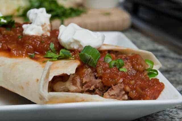 Cheap, easy and delicious, Lincoln Town Car Burritos are a frugal meal of beans, but the pickled onions take them over the top.