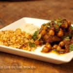 Chicken and Chickpea Tagine with Apricots and Harissa Sauce is so delicious! Go on an adventure in eating to Morocco, for the price of a few spices! #chicken #tagine #Morocco #apricots