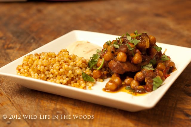 Chicken and Chickpea Tagine with Apricots and Harissa Sauce is so delicious! Go on an adventure in eating to Morocco, for the price of a few spices! #chicken #tagine #Morocco #apricots