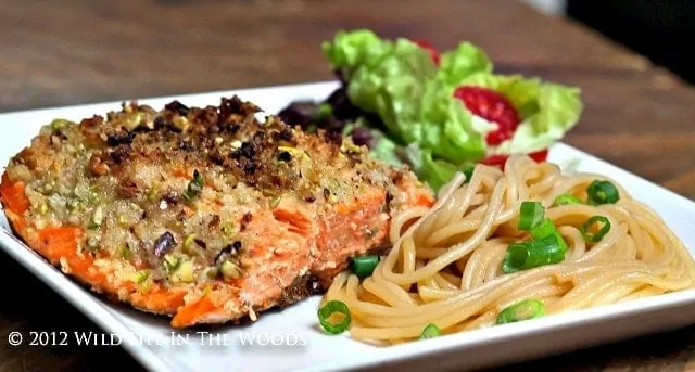 Oven Baked Pistachio Crusted Salmon served with Sesame Noodles and a tossed salad.