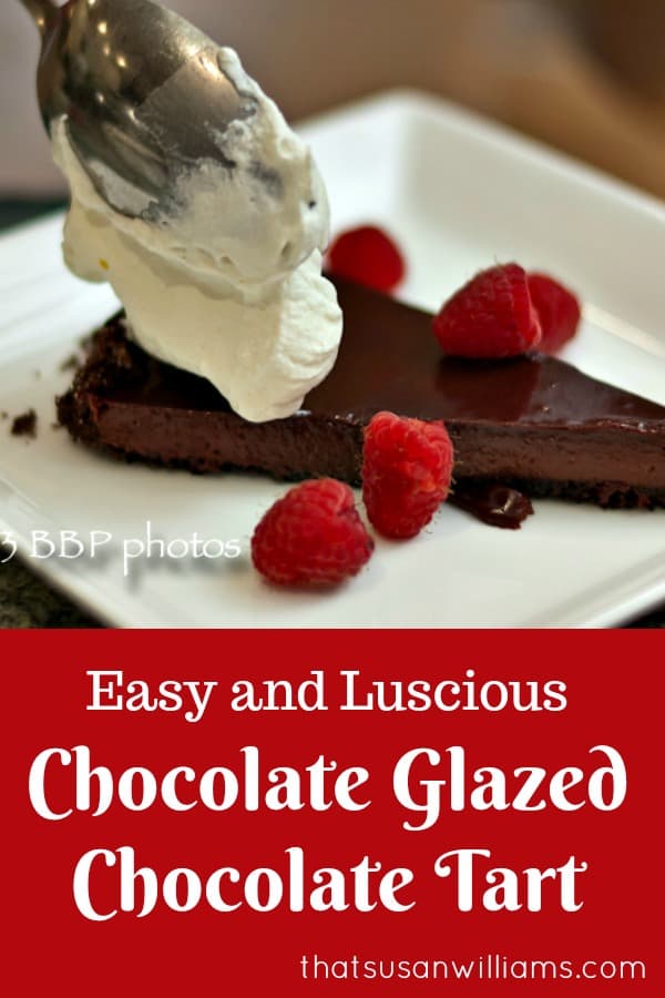 Easy, Luscious, Chocolate Glazed Chocolate Tart, served with Raspberries and Whipped Cream: the perfect dessert for entertaining. #chocolate #chocolatedessert #easychocolatedessert #Valentinesday