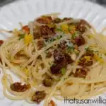 A vegetarian pasta with browned butter, dried fruits and nuts.