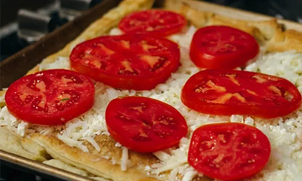 Herbed Tomato Tart Puff pastry, mozzarella cheese, and salted tomatoes.
