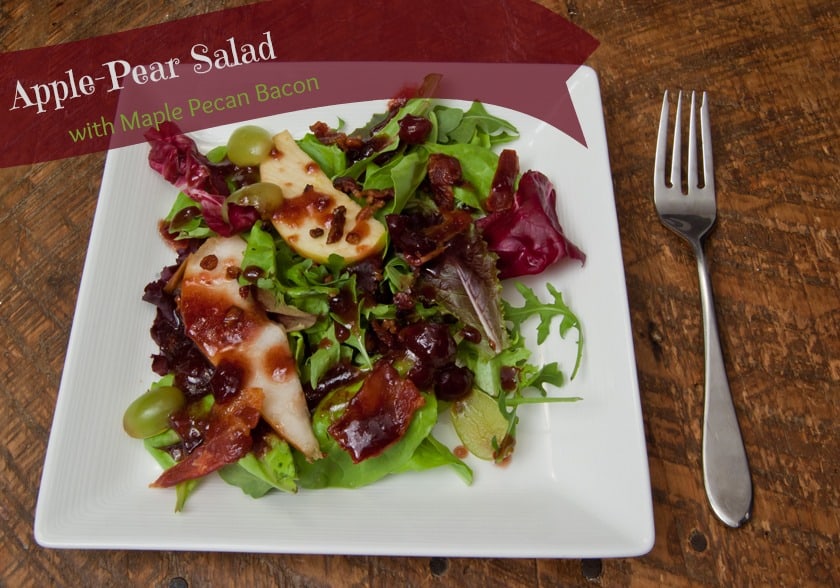 This is the perfect salad for Thanksgiving: apples, pears, grapes, salad greens, with Maple Pecan Bacon, drizzled with a cranberry vinaigrette! #Thanksgiving #thanksgivingsalad #bacon #cranberry