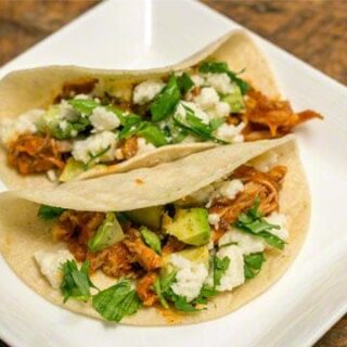 Tinga de Pollo: Shredded Chicken Tacos are easy to make and full of delicious smoky, tangy, fresh and creamy flavor! #tacos #weeknightmeal #chicken #avocados #tingadepollo