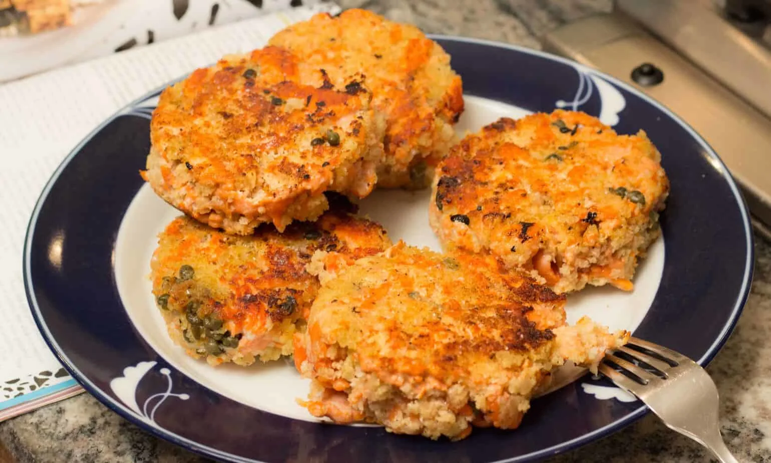 Wild Salmon Burger with Lemon, Capers and Toasted Sesame Mayonnaise: a more affordable way to enjoy salmon burgers.