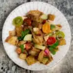 Panzanella is SCRUMPTIOUS! It's a traditional Italian bread salad recipe, and the best use of fresh summer tomatoes, fresh mozzarella, basil, and a balsamic vinaigrette I know!
