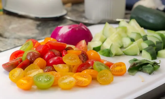 Panzanella is SCRUMPTIOUS! It's a traditional Italian bread salad recipe, and the best use of fresh summer tomatoes, fresh mozzarella, basil, and a balsamic vinaigrette I know! 