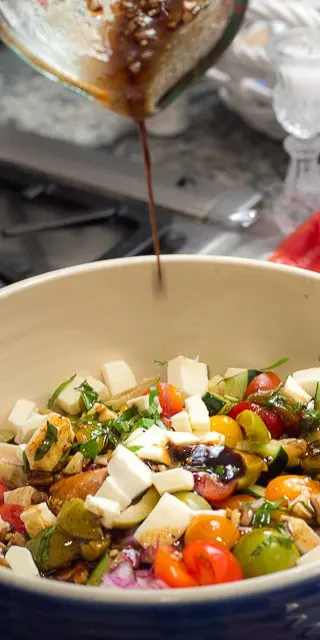 Panzanella is SCRUMPTIOUS! It's a traditional Italian bread salad recipe, and the best use of fresh summer tomatoes, fresh mozzarella, basil, and a balsamic vinaigrette I know!