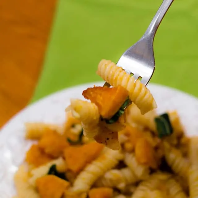 This fall recipe for roasted butternut squash with pine nuts, sage, and browned butter is the perfect comfort food for a cozy autumn evening. #ButternutSquash #bacon #sage #pasta #fallrecipe