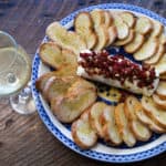 A Thanksgiving appetizer that's quick, easy, beautiful, and amazingly delicious! Goat Cheese with Sun-Dried Tomatoes, Garlic, and Rosemary on Crostini. Perfect for Christmas parties, too! #Thanksgiving #appetizer #holiday #cheese #chevre #goatcheese #cheeseball