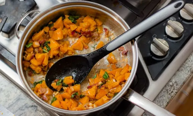 This fall recipe for roasted butternut squash with pine nuts, sage, and browned butter is the perfect comfort food for a cozy autumn evening. #ButternutSquash #bacon #sage #pasta #fallrecipe