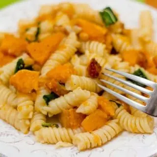 This fall recipe for roasted butternut squash with pine nuts, sage, and browned butter is the perfect comfort food for a cozy autumn evening.