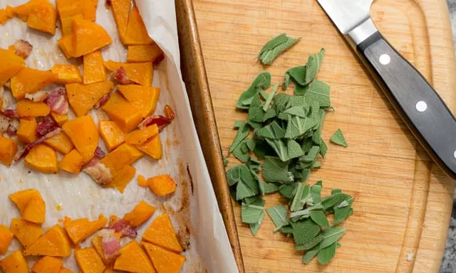 This fall recipe for roasted butternut squash with pine nuts, sage, and browned butter is the perfect comfort food for a cozy autumn evening. #ButternutSquash #bacon #sage