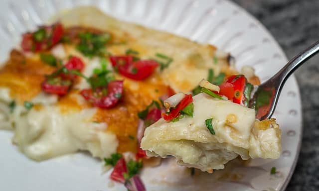 Easy, cheesy, creamy Tex-Mex comfort food! Sour Cream and Green Chile Enchiladas are a Family Favorite. #easy #cheesy #creamy #TexMex #CincodeMayo #enchiladas