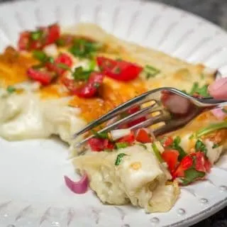 Easy, cheesy, creamy Tex-Mex comfort food! Sour Cream and Green Chile Enchiladas are a Family Favorite. #easy #cheesy #creamy #TexMex #CincodeMayo #enchiladas