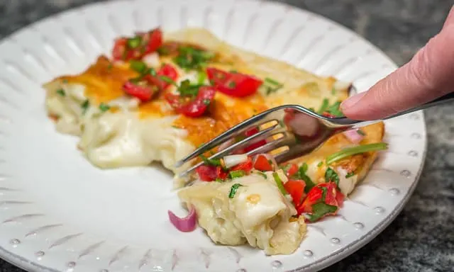 Easy, cheesy, creamy Tex-Mex comfort food! Sour Cream and Green Chile Enchiladas are a Family Favorite. #easy #cheesy #creamy #TexMex #CincodeMayo #enchiladas