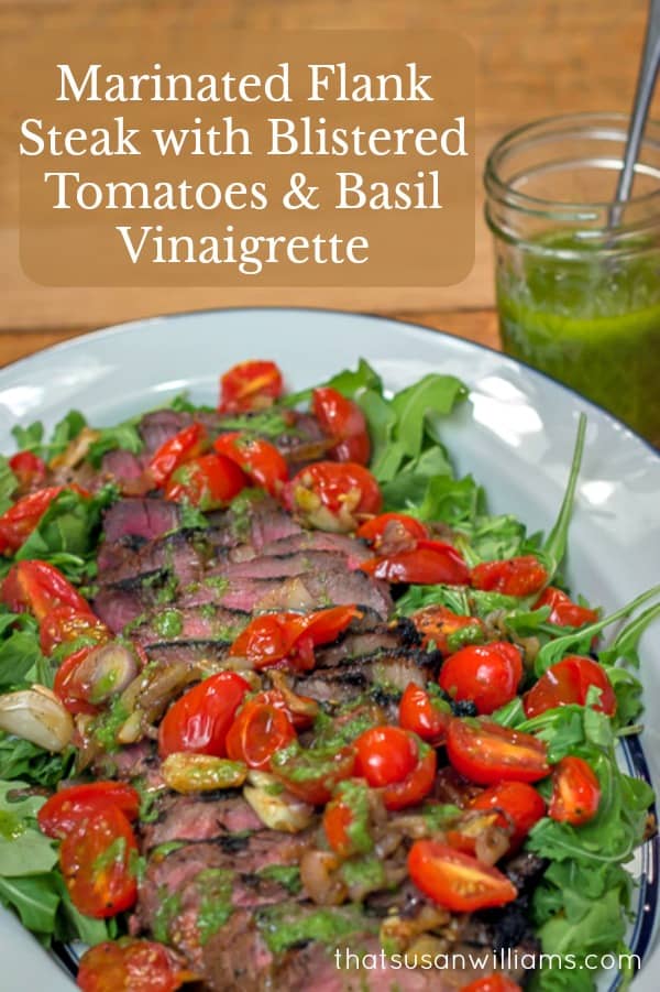 Grilled Marinated Flank Steak with Blistered Tomatoes and Basil Vinaigrette is the perfect meal for easy entertaining. #steak #flanksteak #grilling #tomatoes #arugula