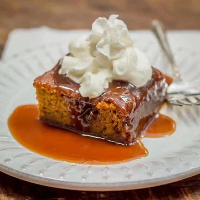 The fall dessert that *had* to happen: the UK's cherished childhood dessert, Sticky Toffee Pudding, meets the USA's pumpkin in the most luscious pumpkin dessert you'll ever have. The toffee sauce alone is enough to make the angels sing! #Thanksgivingdessert #falldessert #Thanksgivingrecipe #pumpkin #pumpkindessert