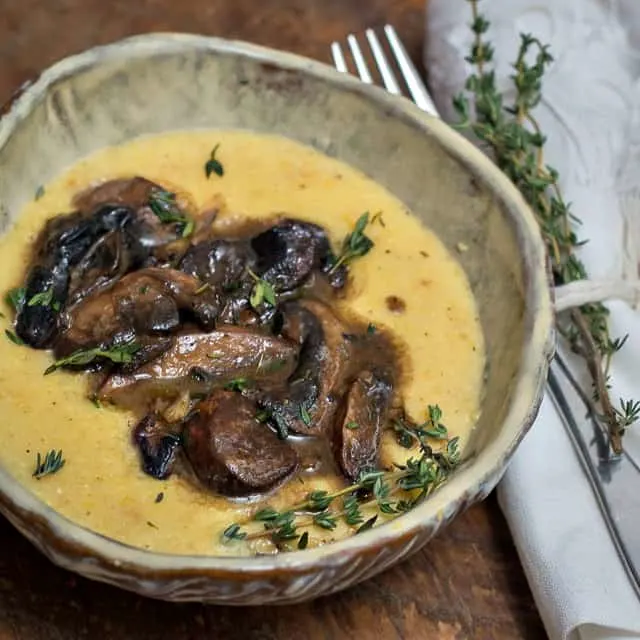 Luscious Mushrooms with Creamy Polenta is a delicious sautéed mushroom recipe, perfect as a vegetarian weeknight meal. #mushrooms #sautéed #recipe #vegetarian