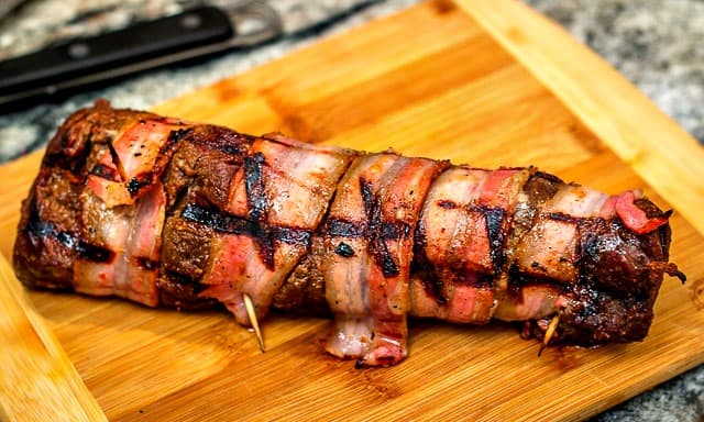 Easy, yet delicious enough for a gourmet palate: Grilled Bacon-Wrapped Venison Backstrap with Balsamic Cherries and Farro #grilling #venison #tenderloin #backstrap #baconwrappedvenison