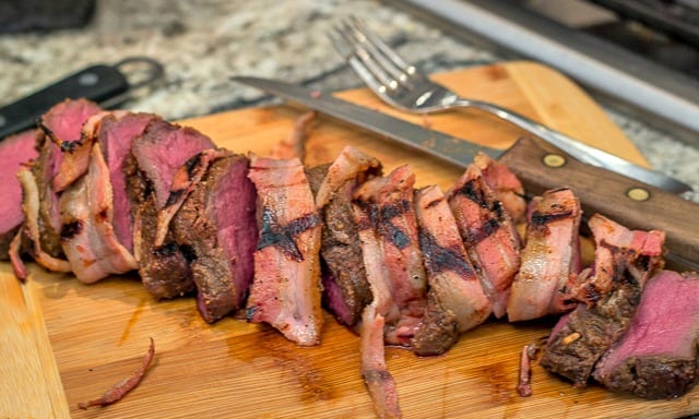 Easy, yet delicious enough for a gourmet palate: Grilled Bacon-Wrapped Venison Backstrap with Balsamic Cherries and Farro #grilling #venison #tenderloin #backstrap #baconwrappedvenison