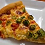 Take two Southern favorites, okra, and pimento cheese, and slather them atop a homemade crust, and you've got an amazingly awesome pizza: Roasted Okra on Pimento Cheese Pizza. #pizza #Southern #okra #pimentocheese