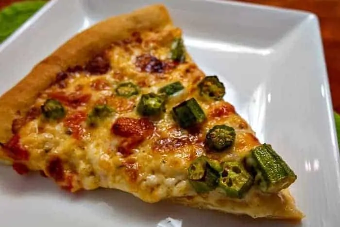 Take two Southern favorites, okra, and pimento cheese, and slather them atop a homemade crust, and you've got an amazingly awesome pizza: Roasted Okra on Pimento Cheese Pizza. #pizza #Southern #okra #pimentocheese