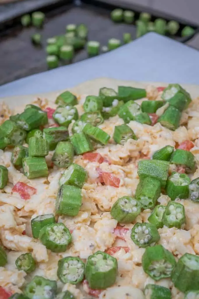 Take two Southern favorites, okra, and pimento cheese, and slather them atop a homemade crust, and you've got an amazingly awesome pizza: Roasted Okra on Pimento Cheese Pizza. #pizza #Southern #okra #pimentocheese