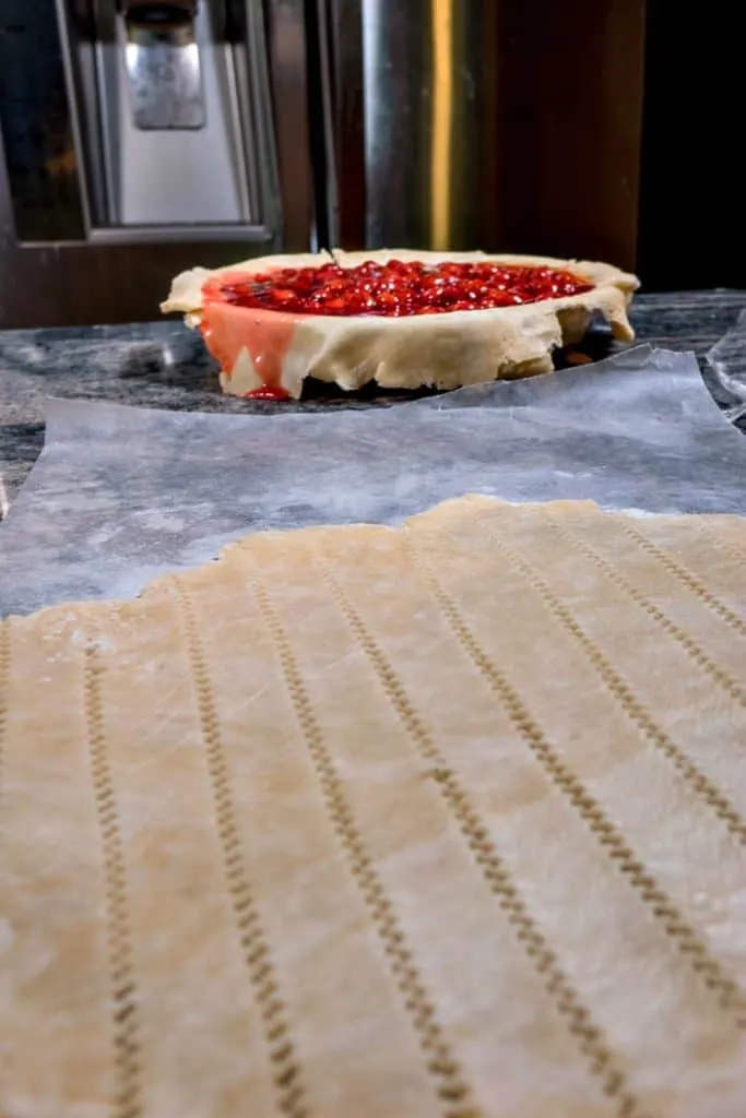 Cutting the pastry into strips, to make a lattice crust.