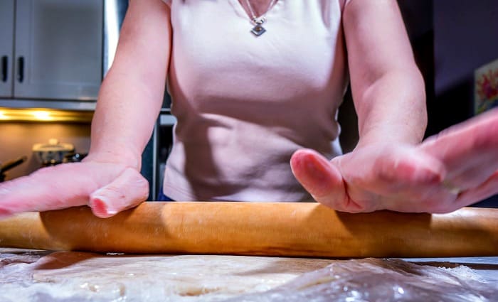 Rolling out the pie crust pastry.