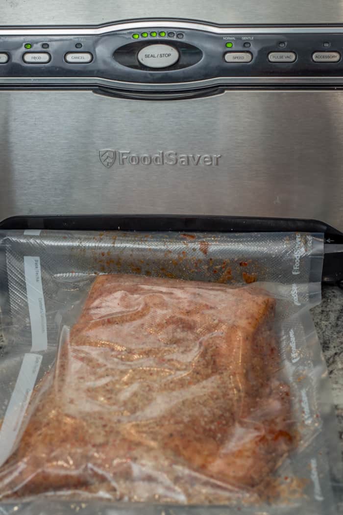 Pork Belly Being Sealed by Food Saver