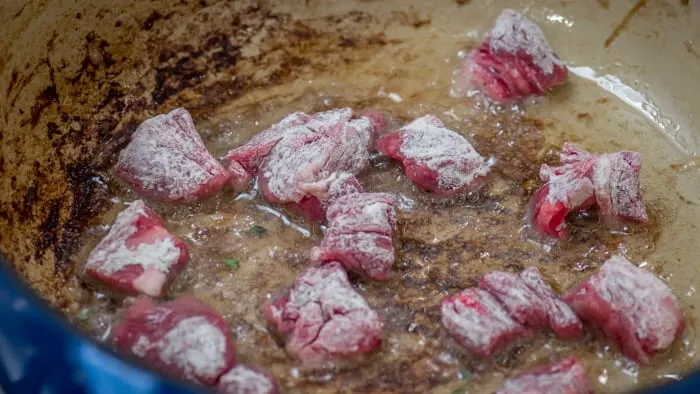 Browning the beef in batches.