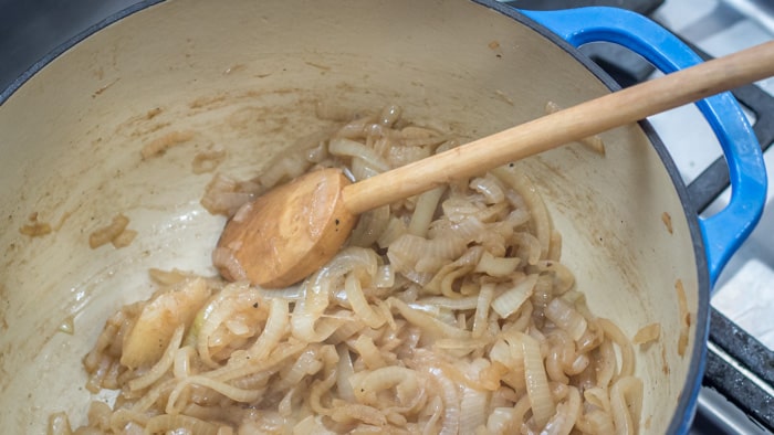 Onions beginning to brown in bacon fat.