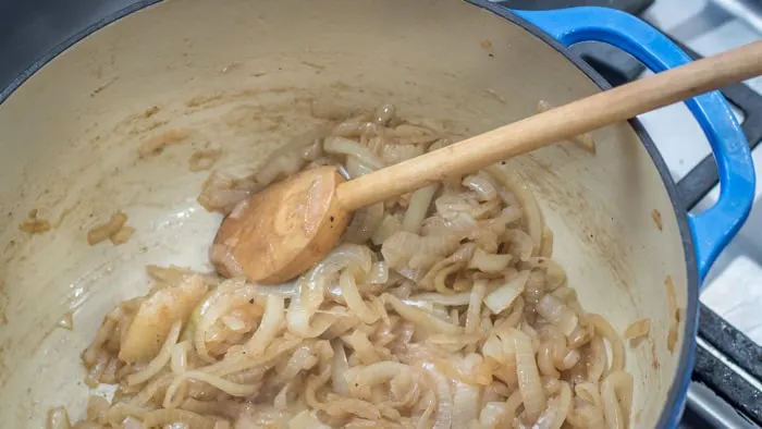 Onions beginning to brown in bacon fat.