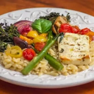 Plated: Sheet Pan Baked Feta with Baby Broccoli, Tomatoes, and Lemon.