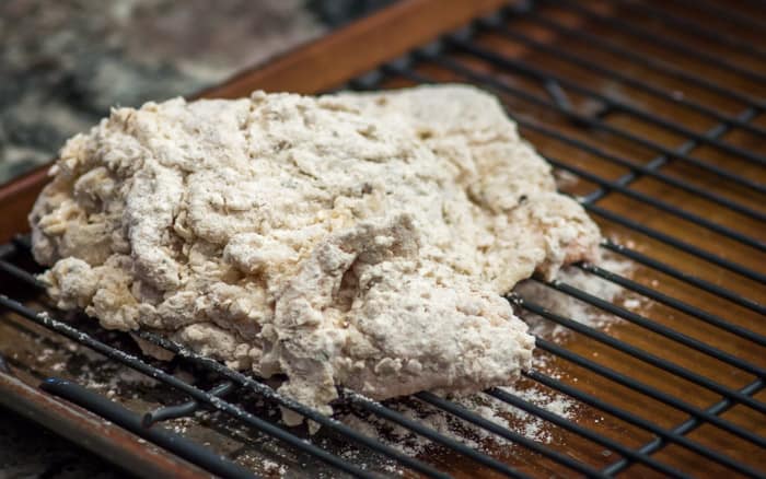 The breaded pieces of chicken go into the fridge for an hour to chill.