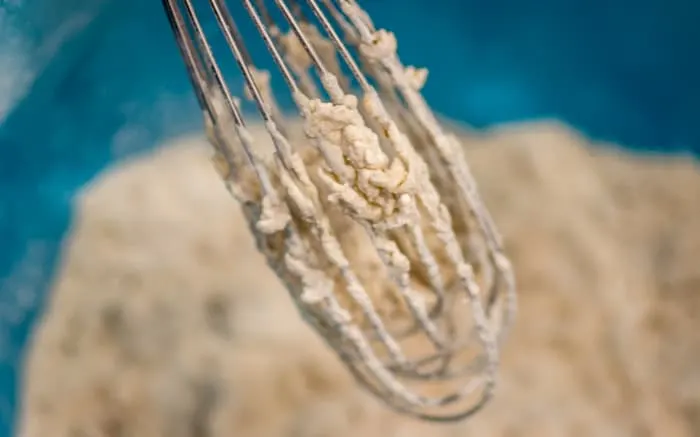 When you pour the buttermilk into the flour and spice mixture, little craggy bits develop.