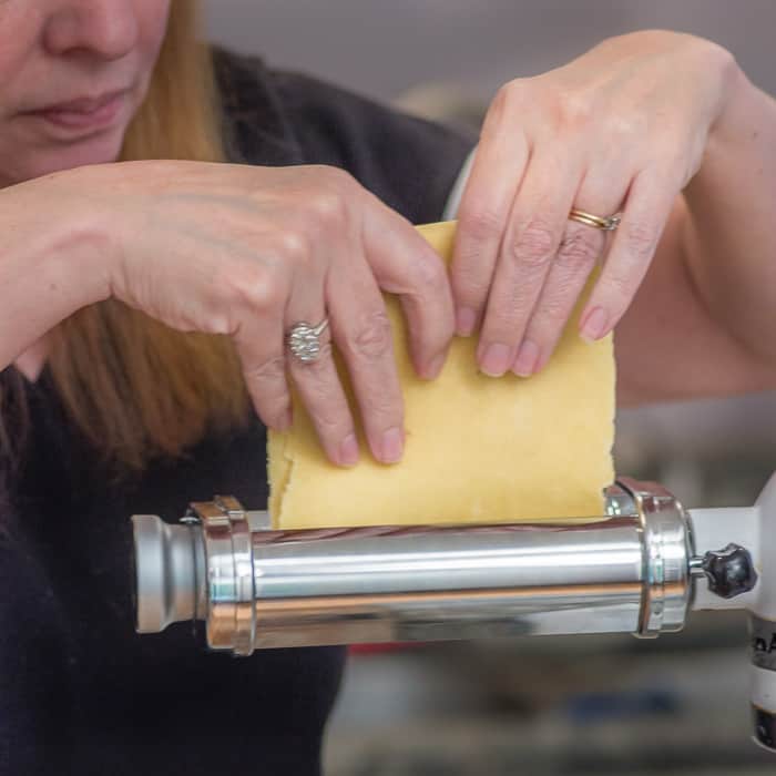 After the first pass through the machine, fold your dough into thirds, and then feed it through the widest setting of the roller again, a few more times. 