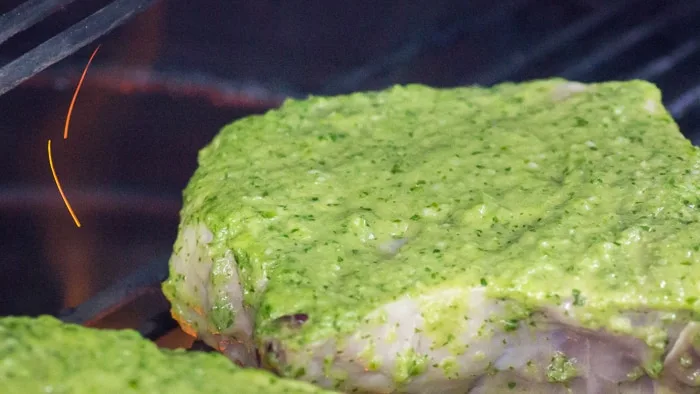 When you first put the pork chops on the grill, the top side will still have that bright, vibrantly colored marinade.