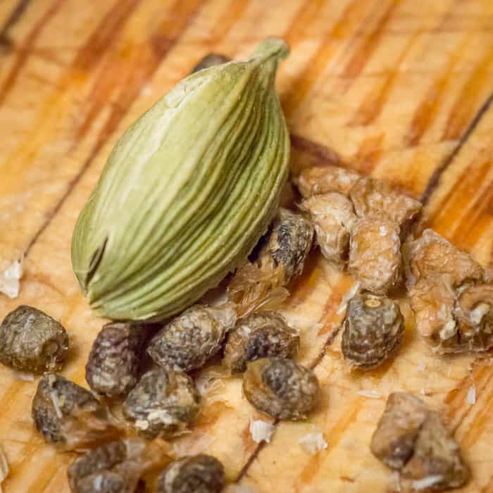 The green cardamom pod, when smashed open, holds brown cardamom seeds.