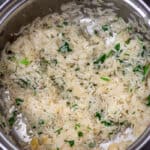 A pot of Easy Cilantro Lime Rice with Cardamom Seeds