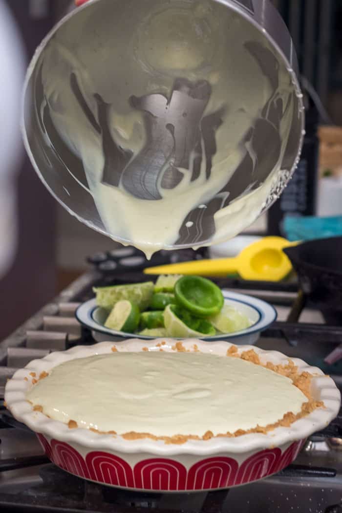 Scraping the bowl of the last of the custard.