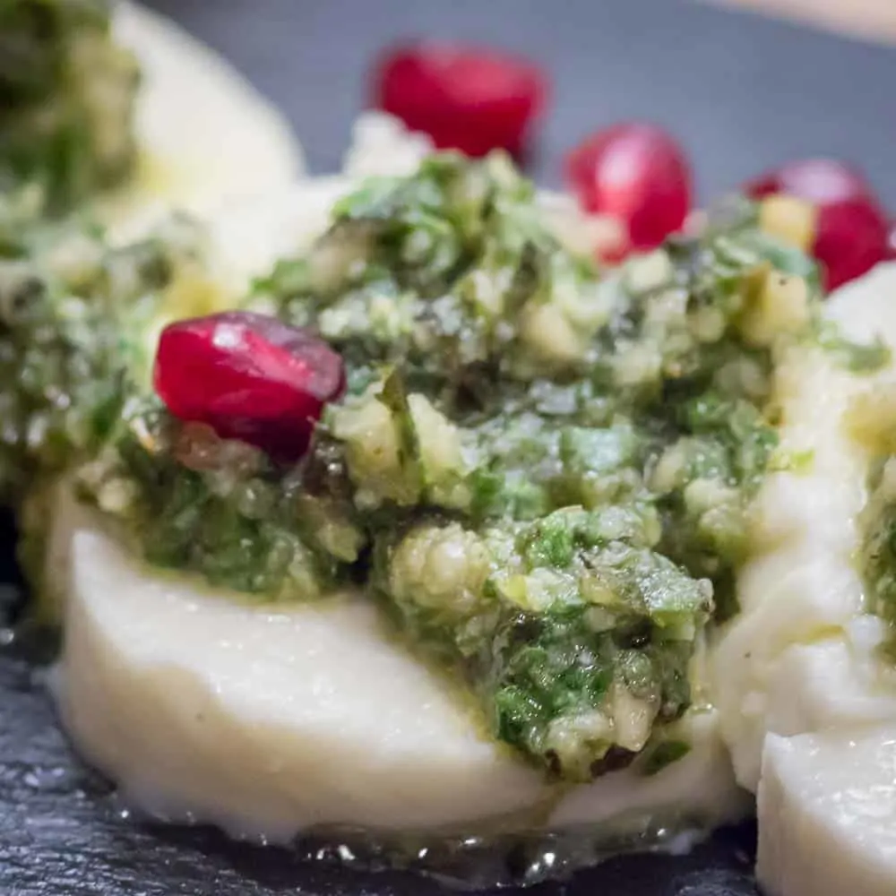 A closeup of the fresh mozzarella and homemade pesto.