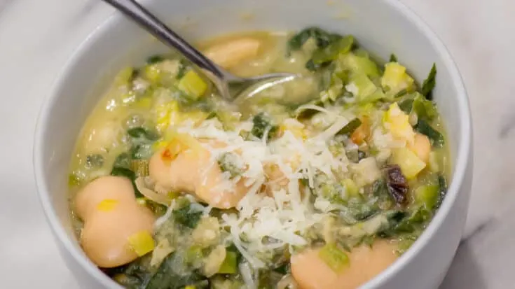 A beautiful bowl of Parmesan White Bean Soup with Swiss Chard and Leeks.