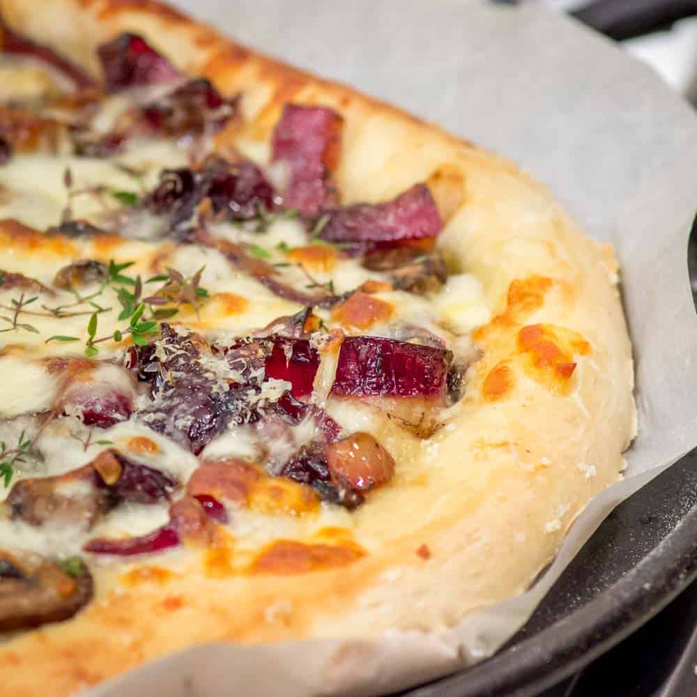 Half of the baked Mushroom, Havarti and Caramelized Red Onion Pizza.