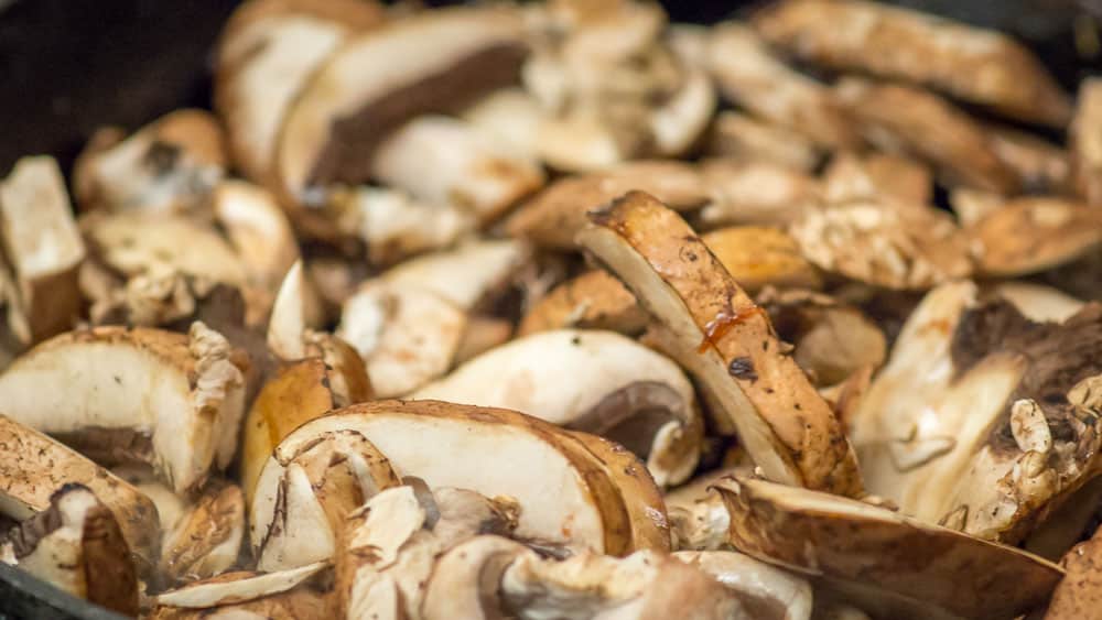 A picture of the mushrooms when they first begin sautéing.