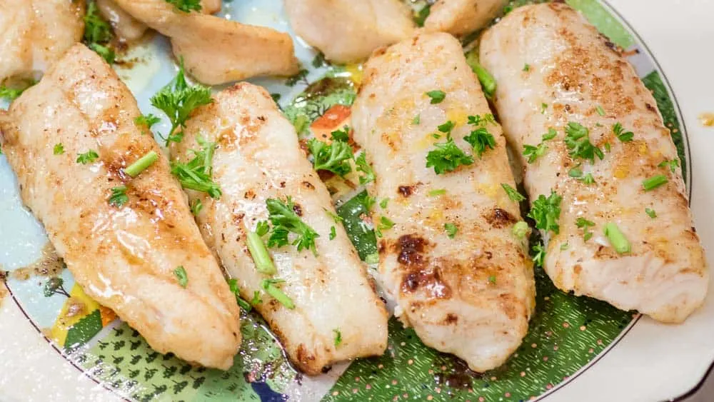 On the platter, sprinkle with parsley and lemon zest.