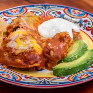 The closeup of the plate of enchiladas.