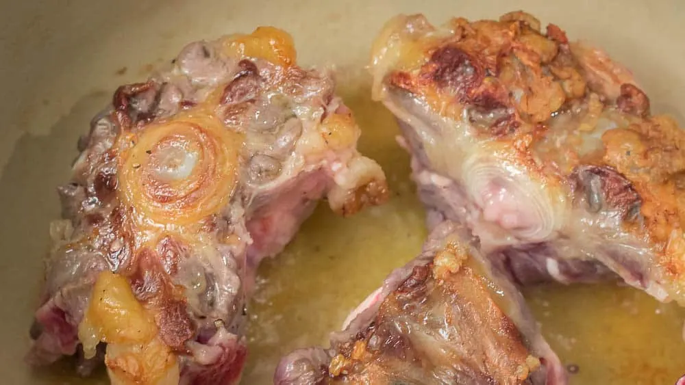 Browning the oxtail.